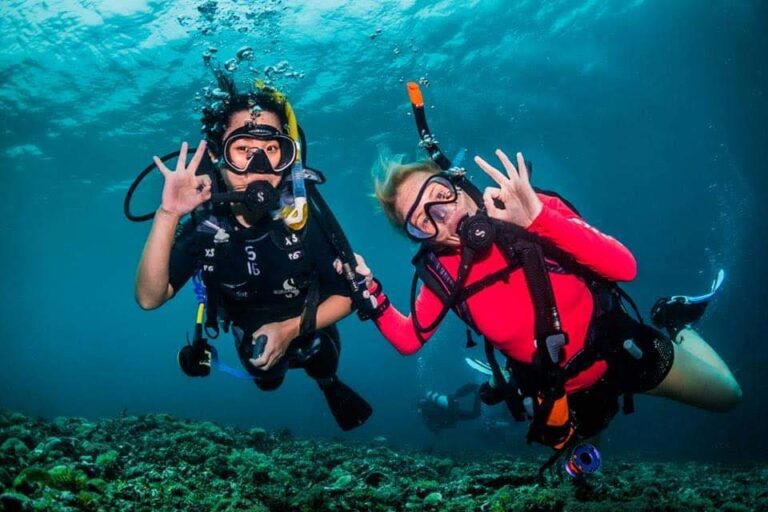 Cassie MSDT with Open Water Diver Student on Coral Reef, Scuba Diving and showing ok hand signal
