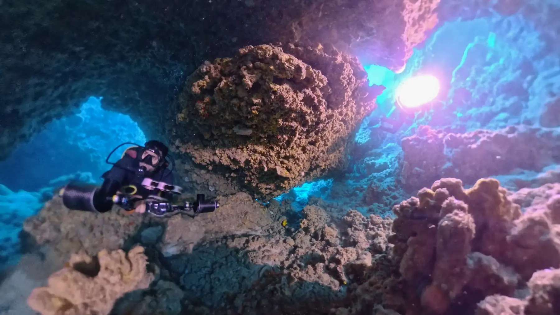 Scuba diver exploring reef near Kuta Lombok dive sites
