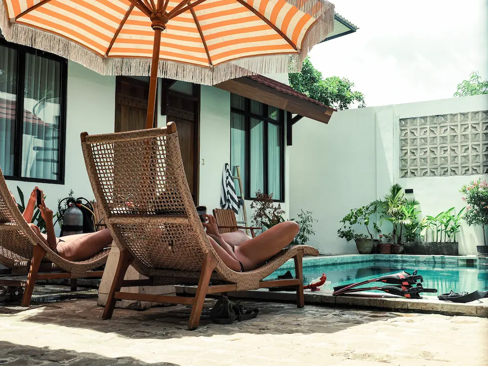 Relaxing by the pool after scuba diving in Kuta Lombok Indonesia