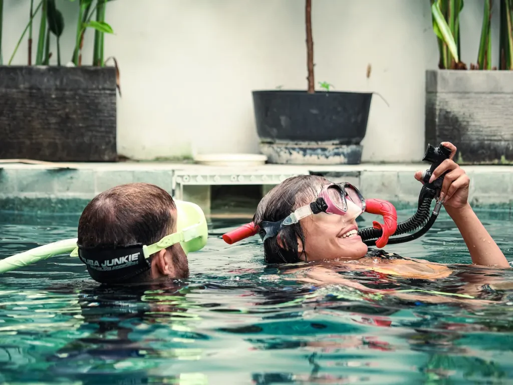 Diver learning to use a regulator during scuba training in Kuta Lombok