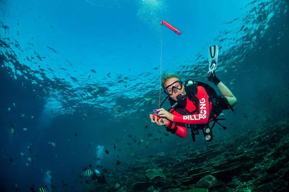 Surface marker buoy used during scuba diving drift dive safety procedures