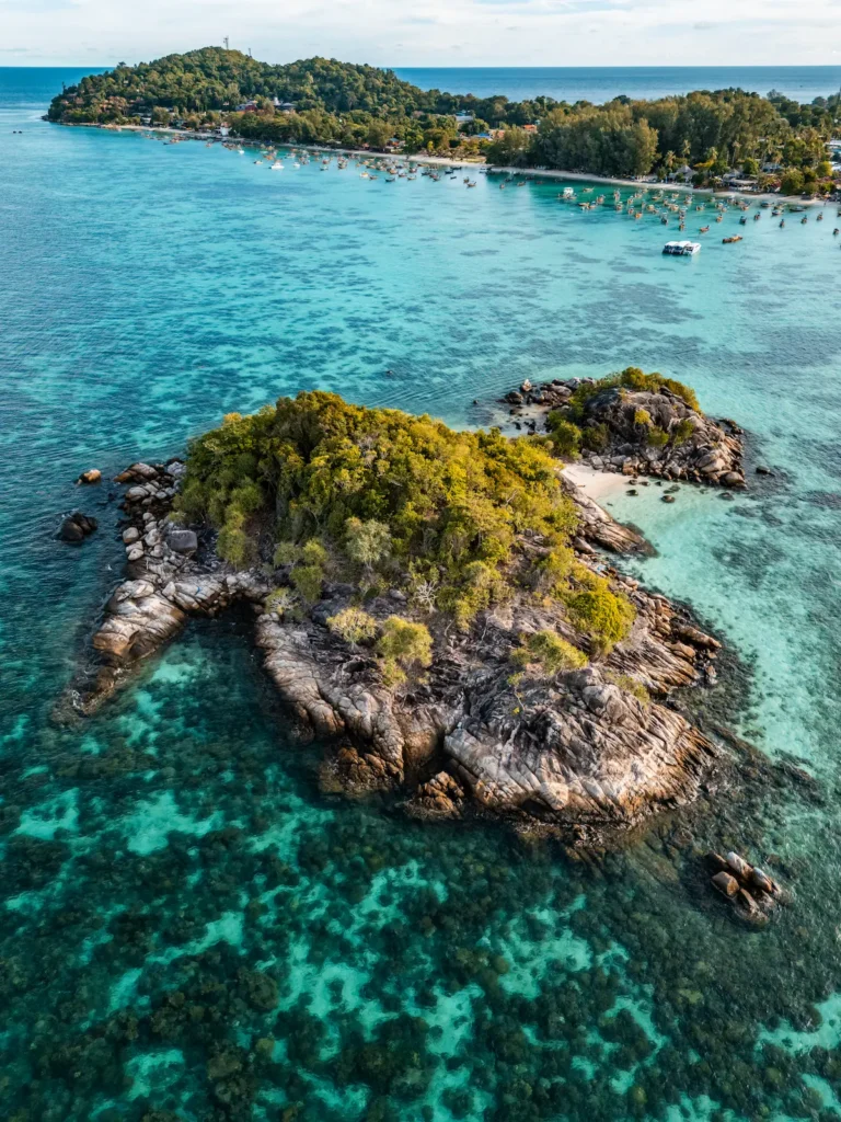 Kayaking from Koh Lipe to a small offshore island in clear turquoise water