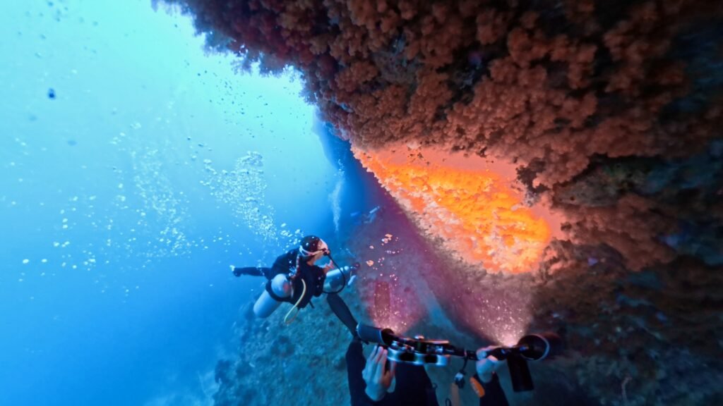 Scuba diver controlling BCD buoyancy while ascending